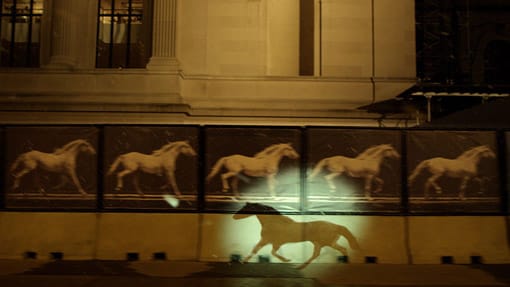 Projection of a silhouette of a horse over the Metropolitan Museum of Art