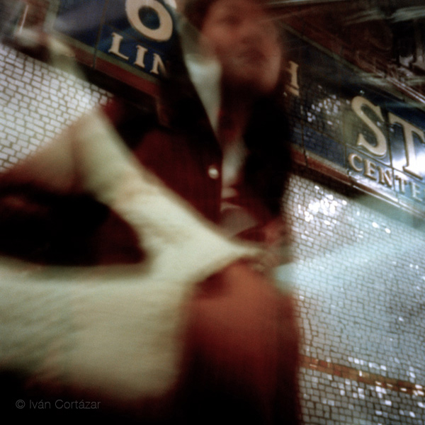 A pinhole photograph of a woman waiting for the subway