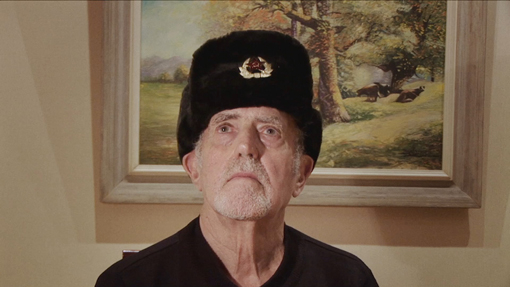 A senior man with a communist hat