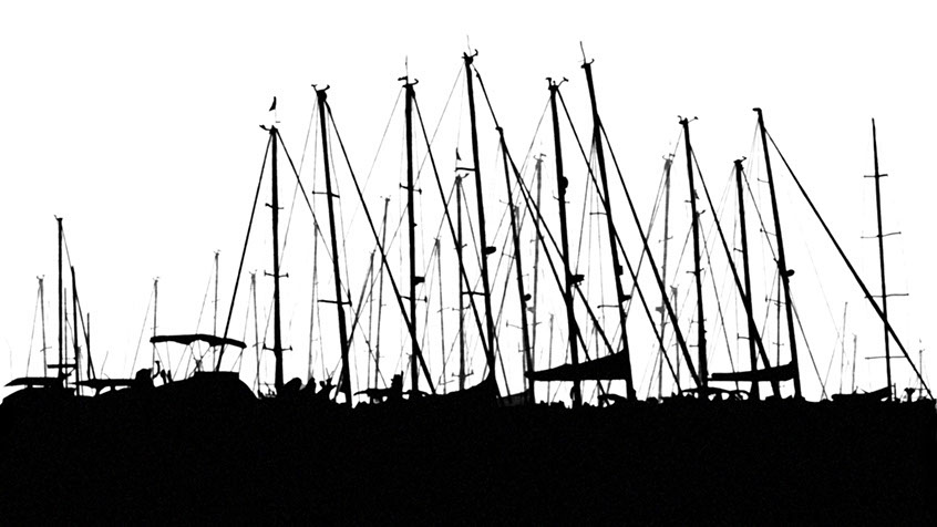 A back and white silhouette of sailboats